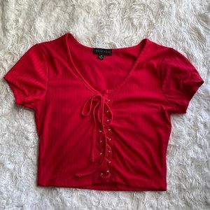 Medium red crop top only worn Once. Can be dressed up or be worn casual.